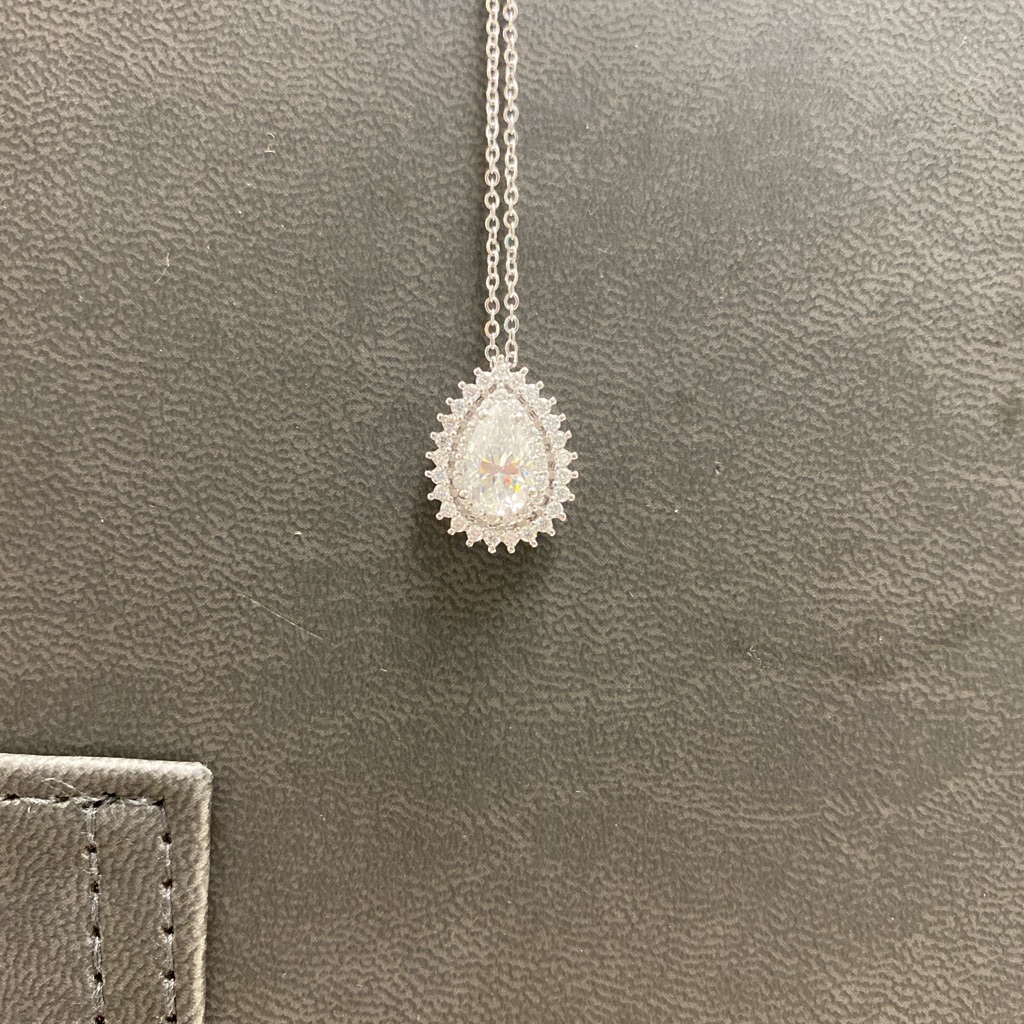 Pear Shaped Moissanite & Silver Pendant With Halo